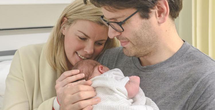 New parents with their newborn baby