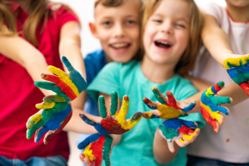 Children with painted hands 