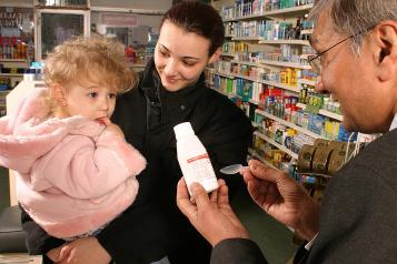 pharmacist talking to mum and daughter