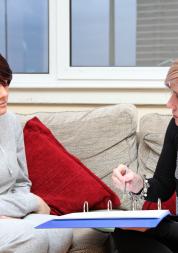 a young lady talking to their support worker about their mental health